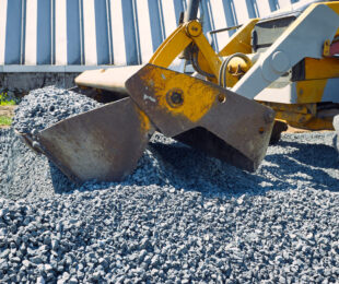 Heavy construction bulldozer of yellow color when building a road.